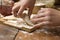 Detail of hands kneading dough