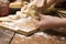 Detail of hands kneading dough