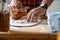 Detail of hands of men rolling the dough. Preparation for baking of traditional czech pastry. Homemade fresh food