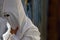 Detail on a hooded penitent waiting for the start of an easter holy week procession in mallorca detail on hoods detail