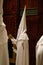 Detail on a hooded penitent waiting for the start of an easter holy week procession in mallorca detail on hoods vertical