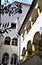 Detail of a house with arcades on the first and second floors, with flower pots, inside a courtyard in Graz.