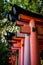 Detail of the iconic torii gates at the Fushimi Inari-Taisha shrine in Kyoto, Japan.