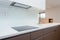 Detail of induction cooker in contemporary kitchen