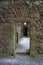 Detail from inside ruined Balvaird Castle in Scotland showing doorway, passageway and spiral stone staircase