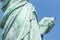 Detail of the Lady Liberty statue, book with the date of USA`s independence
