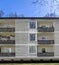 Detail of a large ugly townhouse with cheap housing on the outskirts of a large industrial metropolis