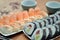 Detail of maki sushi rolls and nigiri sushi with salmon and shrimp japan food on the table