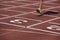 Detail of a male athlete leg crossing the finish line