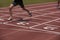 Detail of a male athlete in a running track