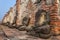 Detail of many headless Buddhas along a temple wall at Wat Mahathat