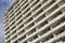 Detail of massive old block of flats with many apartments with balconies