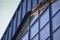 Detail of a modern steel clad building with a window to match the roof pitch