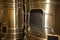 Detail modern wine cellar with stainless steel tanks vats