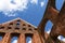 Detail of a monastery ruin of brick masonry against the blue sky