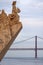 Detail of the Monument to the Discoveries Padrao dos Descobrimentos with the 25 of April Bridge on the background in the city of