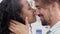 Detail of a multi-ethnic heterosexual couple kissing. Love, lovers, honeymoon, valentine\'s day