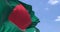 Detail of the national flag of Bangladesh waving in the wind on a clear day