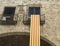 Detail of national flag of Catalonia hanging on a balcony from t