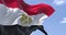 Detail of the national flag of Egypt waving in the wind on a clear day