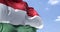Detail of the national flag of Hungary waving in the wind on a clear day