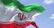 Detail of the national flag of Iran waving in the wind on a clear day