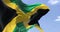 Detail of the national flag of Jamaica waving in the wind on a clear day