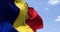 Detail of the national flag of Romania waving in the wind on a clear day