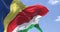 Detail of the national flag of Seychelles waving in the wind on a clear day