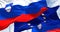 Detail of the national flag of Slovenia waving in the wind with blurred european union flag