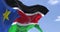 Detail of the national flag of South Sudan waving in the wind on a clear day