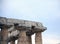 Detail of the node between the column and the lintel of the temple, against the cloudy sky,  Paestum, Cilento, Campania, Italy