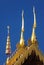 A detail of northern thai temple gable ,Chofah , under clear blue sky