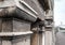 Detail of an old and abanonded Train Station showing detail of its architecture next to a railway platform.