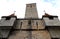 Detail of an old building with stone mask and old tower in the town of Rothenburg in Germany