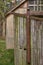 Detail of an old conical capped small stove chimney in an outhouse attached to a derelict wooden Religious building