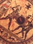 Detail from an old historical greek paint over a dish. Mythical heroes and gods fighting on it