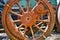 Detail of an old rusty weathered iron red wheel of a historic locomotive