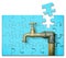 Detail of a old water brass faucet isolated on solid color background - solution concept in jigsaw puzzle shape