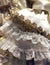 detail of an old wedding dress in ivory color with floral decorations