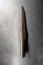 Detail of original prehistoric or medieval weapons - spear, used by tribes for hunting. Rustic iron weapon found by archeologists