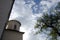 Detail of orthodox church with cross and tree