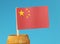 A detail on paper national flag of China on wooden stick in wooden barrel