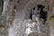Detail in the park - old stone statue with angels, Quinta da Regaleira in Sintra