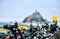 Detail of parked bicycles, with defocused silhouette of Mont Saint Michel, France