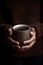 Detail of a person offering a mug of coffee. Generative AI.