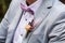 A detail photo of a grooms wedding boutonniere