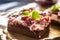 Detail of a piece of brownie with a cream, cherries and fresh mint leaves