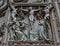 Detail of the Pieta scene in bas-relief at Milan`s Cathedral doors