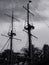 Detail of pirate ship mast docked at the beach with dark sky